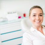 Smiling woman in the dental chair for a botox treatment.